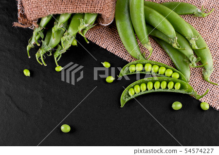 Sugar snap peas with mint on a rustic wood Sugar snap peas with mint on a rustic wood 54574227