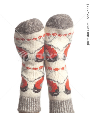 Wool socks on woman's feet isolated on white 54575431