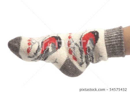 Wool socks on woman's feet isolated on white 54575432