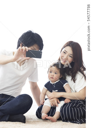 Family taking a picture with selfie Family taking a picture with selfie 54577786