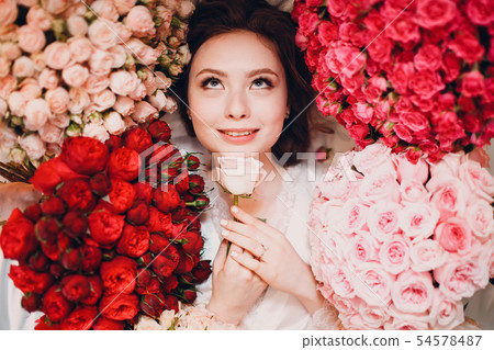Dreaming young female and flowers 54578487