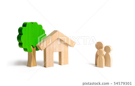 Wooden house and family. Buying a new home. Wooden house and family. Buying a new home. 54579301