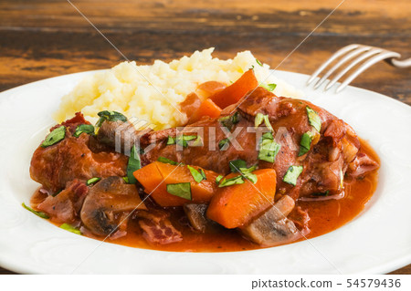 Coq au Vin, traditional French recipe of chicken 54579436