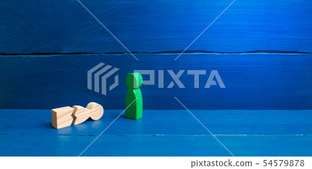 A figurine of a green man stands over a fallen A figurine of a green man stands over a fallen 54579878