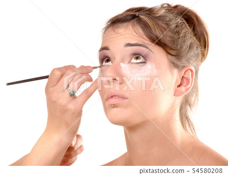 pretty young woman is make up 54580208