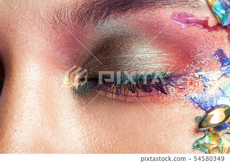 Portrait of a beautiful Girl with colorful makeup on her face Portrait of a beautiful Girl with colorful makeup on her face 54580349