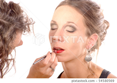 pretty young woman is make up 54580569