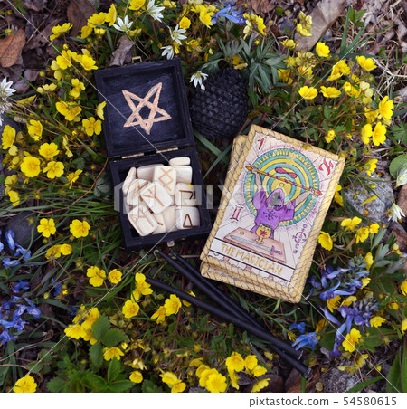 Witch runes, black candles and tarot cards 54580615