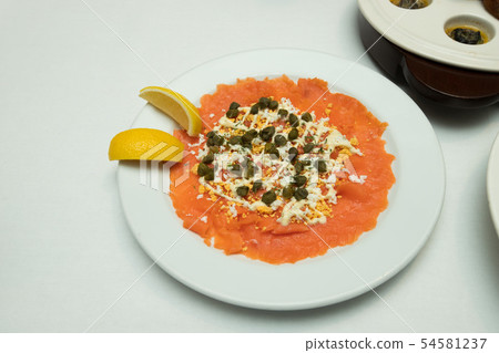 Salmon slice by fork knife with experience chef Salmon slice by fork knife with experience chef 54581237