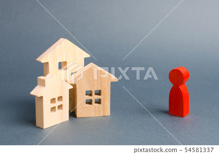 Wooden figures of houses and a red figure  54581337