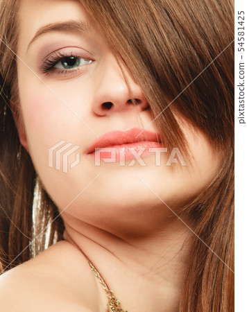 Hairstyle. Portrait of girl with long bang Hairstyle. Portrait of girl with long bang 54581425