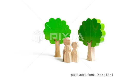 Family figures are standing near the trees. Family figures are standing near the trees. 54581874