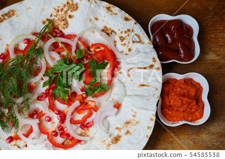 Red bell peppers, onions, pomegranate and parsley Red bell peppers, onions, pomegranate and parsley 54585538