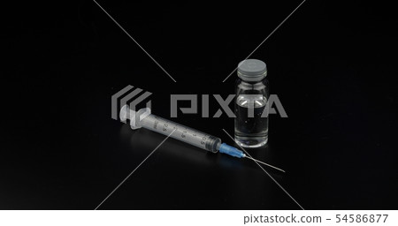 syringe, ampoule with vaccination on black 54586877