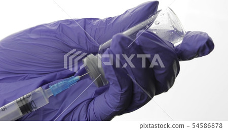 Doctor fill the syringe with vaccine Doctor fill the syringe with vaccine 54586878