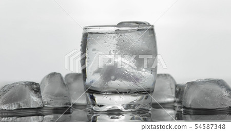 Shot of vodka in glass. White background 54587348