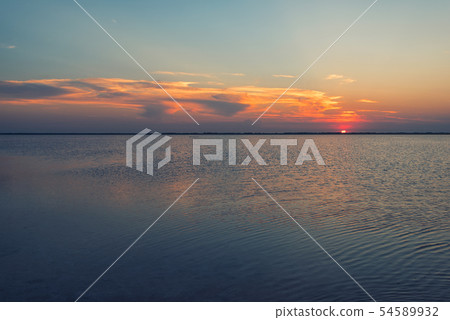 Beauty sunset on salty lake Beauty sunset on salty lake 54589932