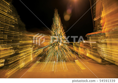Christmas tree with lights in abstract way Christmas tree with lights in abstract way 54591339