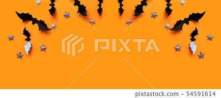 Halloween flat lay composition of black paper bats Halloween flat lay composition of black paper bats 54591614