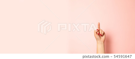 Female hand with red manicure shows aggressive 54591647