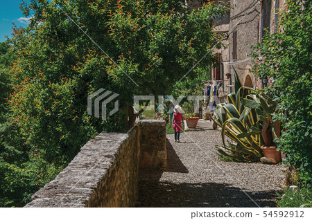 Alley view with pebble walkway and little girl 54592912