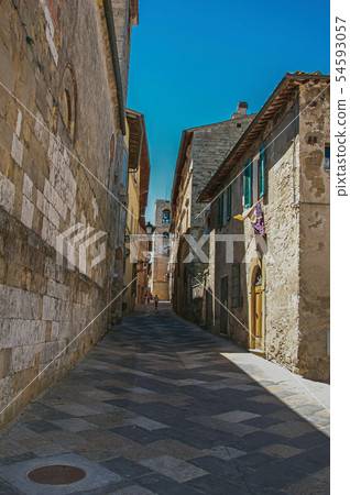 Narrow alley with old buildings and belfry Narrow alley with old buildings and belfry 54593057