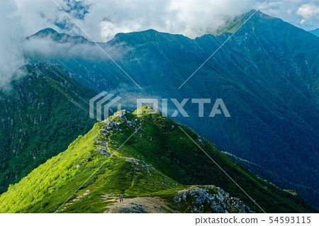 The ridgeline of the central alp where clouds spring 54593115