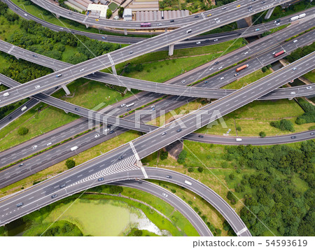 Aerial view of cars driving on highway junctions. 54593619