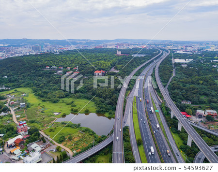 Aerial view of cars driving on highway junctions. Aerial view of cars driving on highway junctions. 54593627