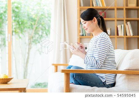 A young lady (a smartphone) A young lady (a smartphone) 54595045