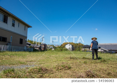 Elderly man mowing Elderly man mowing 54596063