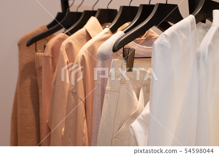 Fashion Design Clothes on Display rack in retail Fashion Design Clothes on Display rack in retail 54598044