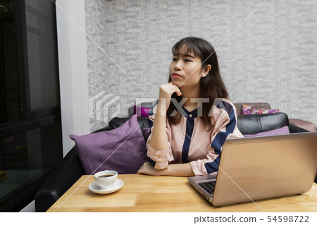Businesswoman sitting in front of the laptop Businesswoman sitting in front of the laptop 54598722