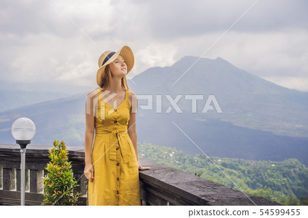 Woman traveler looking at Batur volcano. Indonesia 54599455