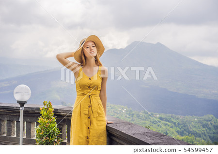 Woman traveler looking at Batur volcano. Indonesia 54599457