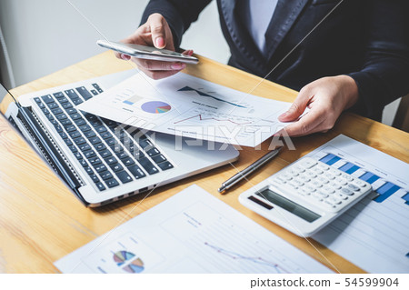 Businesswoman accountant working analyzing and Businesswoman accountant working analyzing and 54599904