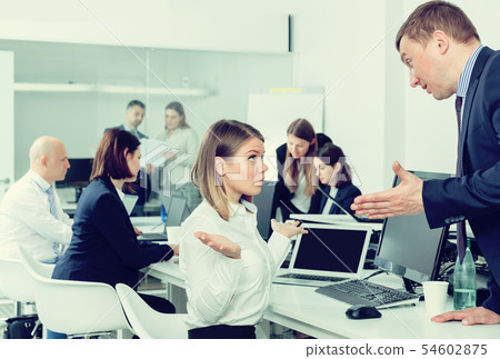 Boss scolding female subordinate 54602875