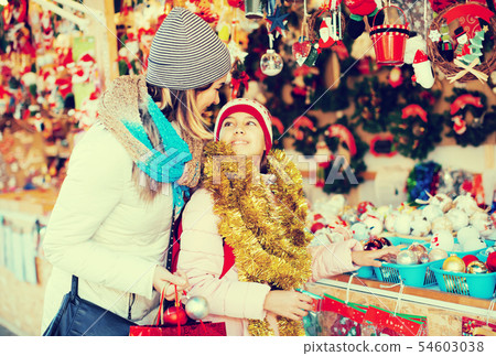 Ordinary mother with small daughter in market 54603038