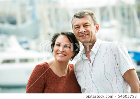 Laughing couple in love posing outdoors 54603758