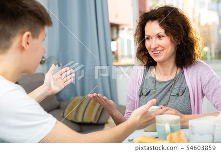 Mother and son enjoying conversation 54603859