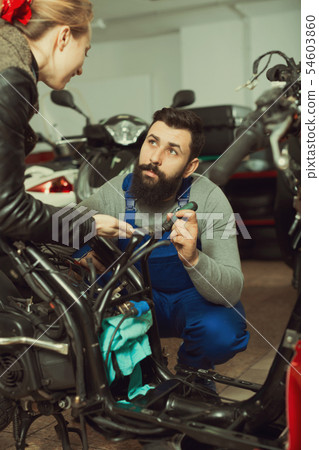 Worker helping woman 54603860