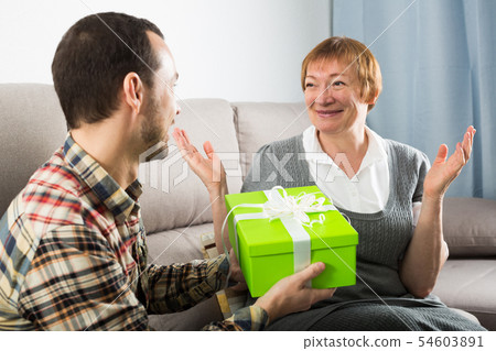 Son giving present to mother 54603891