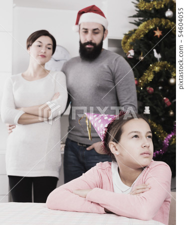 Parents lecturing daughter at Christmas 54604055