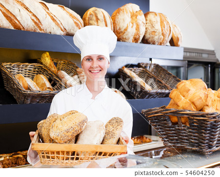 Bakery female employee with tasty Bakery female employee with tasty 54604250