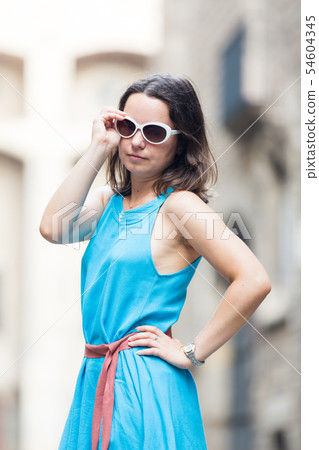 Girl walking in city streets 54604345