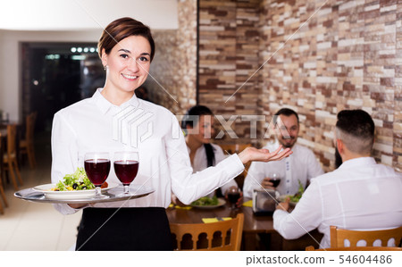 Female waiter showing country restaurant 54604486
