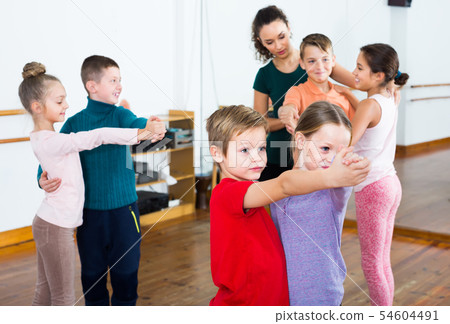Little boys and girls dancing pair dance Little boys and girls dancing pair dance 54604491