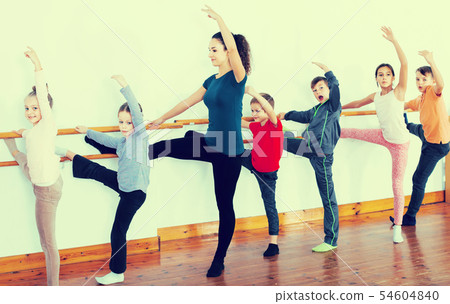 Group of children practicing at the ballet barre Group of children practicing at the ballet barre 54604840