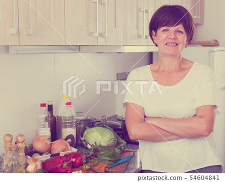 smiling mature woman kitchen 54604841