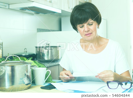 stressful woman paying bills 54604844